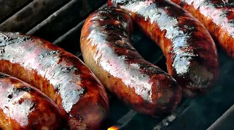 Grilling sausages Stock Footage 10860700
