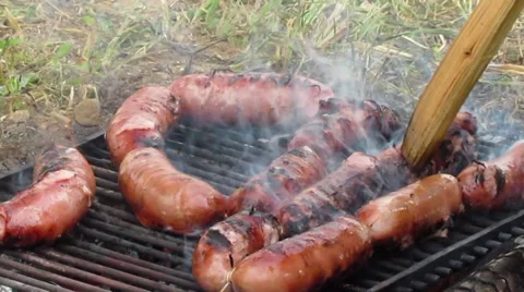 Grilling sausages Stock Footage 27877807