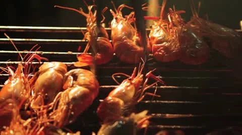 Grilling Shrimp on a Barbeque at Night Stock Footage 8973661
