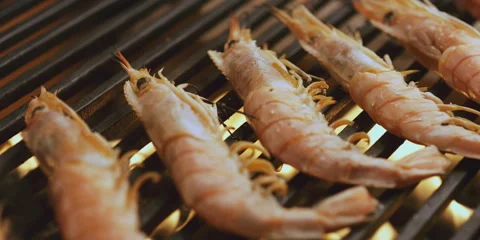 Grilling shrimps on the stove Stock Footage 247379448