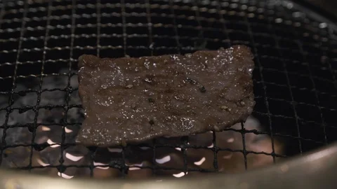 Grilling slices of wagyu beef  Stock Footage 111929650