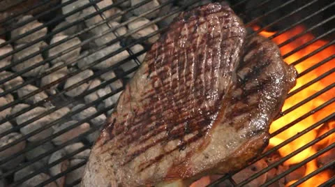 Grilling steak on barbeque Stock Footage 11400138