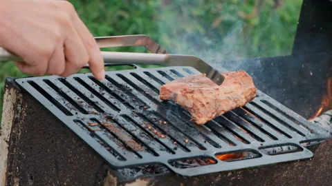 Grilling a steak with fire Stock Footage 286348090