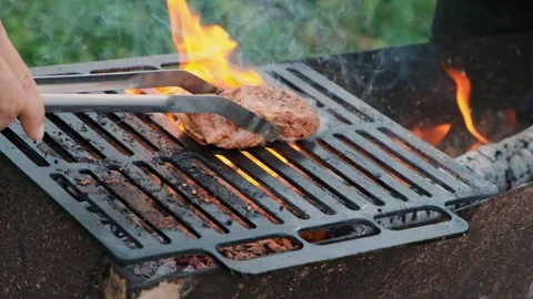 Grilling a steak with fire Stock Footage 286357495
