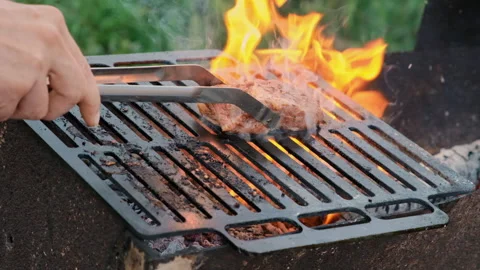 Grilling a steak with fire Stock Footage 286358973