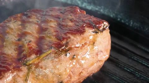 Grilling steak on a grill pan. Beef tender steak on the grill pan. Stock Footage 131320647