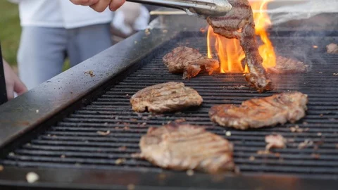 Grilling Steak Outdoors - Slow Motion Stock Footage