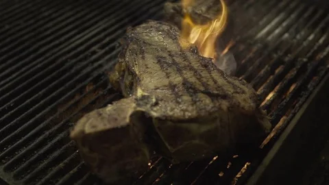 Grilling steak slow-mo Stock Footage 69781100