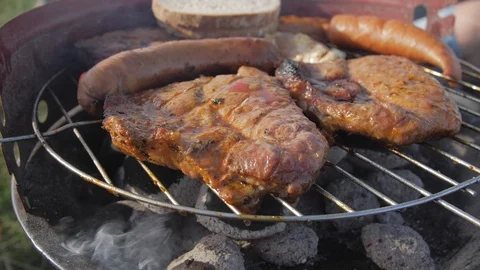 Grilling steaks on the grill plate, close up, 4k grilled meat, bbq, barbecue 動画素材 116038153