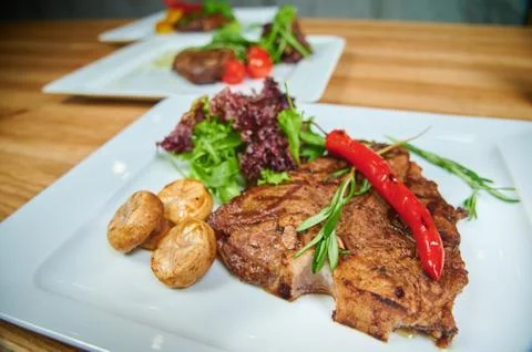 Grilling steaks Stock Photos