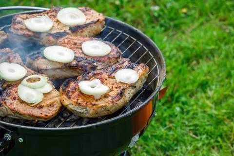 Grilling steaks at summer weekend Stock Photos
