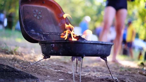 Grilling at summer weekend. Grill is on fire. Glowing charcoal and flame in the Stock-Footage 93505499