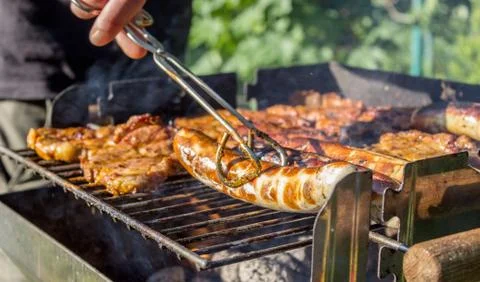 Grilling at sunset Stock Photos