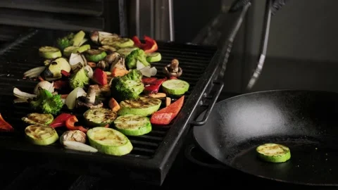 Grilling vegetables in a charcoal oven. Stock Footage 153545101