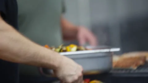 Grilling Vegetables on Flat Top Grill in Professional Kitchen 動画素材 336014408