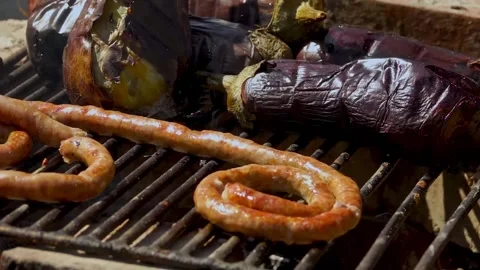 Grilling Vegetables over Wood Fire for Traditional Romanian Zacusca Video stock 288689112