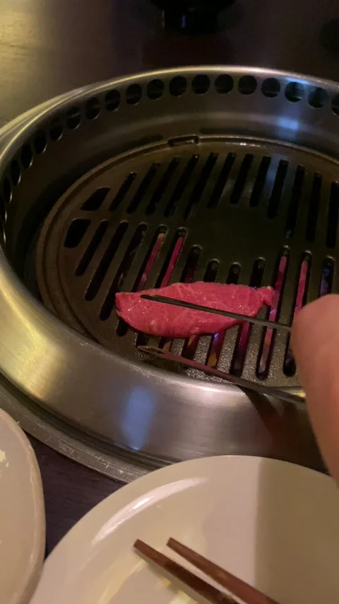 Grilling wagyu at the table Stock Footage 219716531
