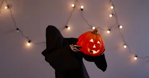 Grim Reaper Dancing With Pumpkin On Grey Background Stock Footage 312695695