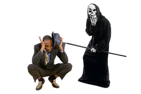 Grim reaper Ghost Scaring a Man in a Suit Stock Photos
