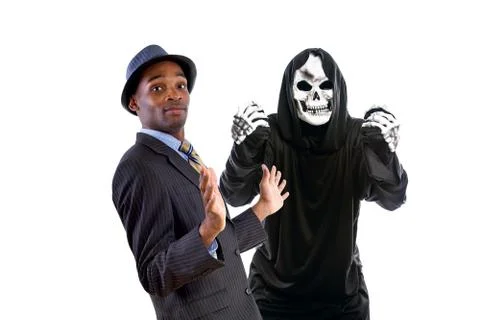 Grim reaper Ghost Scaring a Man in a Suit Stock Photos