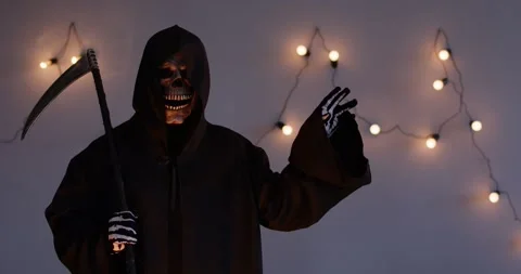 Grim Reaper Pointing Right with Scythe on Grey Background Stock Footage 321702853