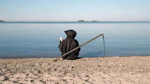 Grim Reaper Sitting by Lake with Cup of Coffee Stock Footage 135738501