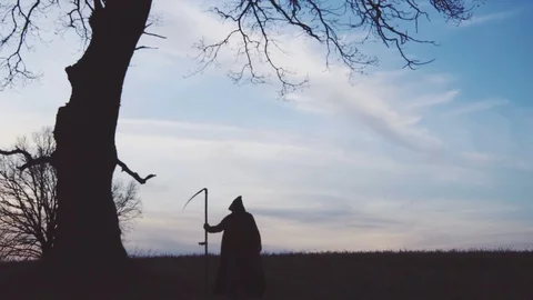 Grim Reaper sunset silhouette. concept of death. Stock Footage 102114832
