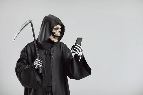 Grim Reaper Using Mobile Phone On Grey Background Stock Photos
