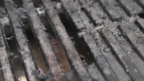 Grimy old Barbeque grill close up stock sliding camera move stock footage Stock Footage 337695969