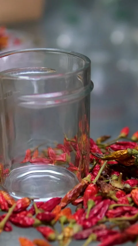 Grind in an automatic blender grind red chili pepper woman hand's added Stock Footage 302072015