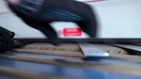 Grind a CNC car. A production worker takes the finished parts Stock-Footage 201820318