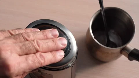 Grind Coffee Beans in an Electric Coffee Grinder Stock Footage 149252244