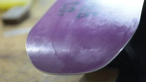 Grind edge on a snowboard in the service Stock Footage 105651613