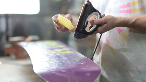 Grind edge on a snowboard in the service Stock Footage 105651760