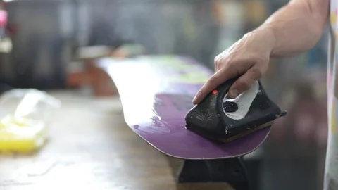 Grind edge on a snowboard in the service Stock Footage 105651792
