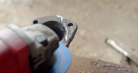 Grind the edges of the pipe flange after welding. Stock Footage 313495968
