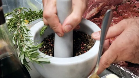 Grind peas in a mill. Pepper in a mortar Stock Footage 102881396