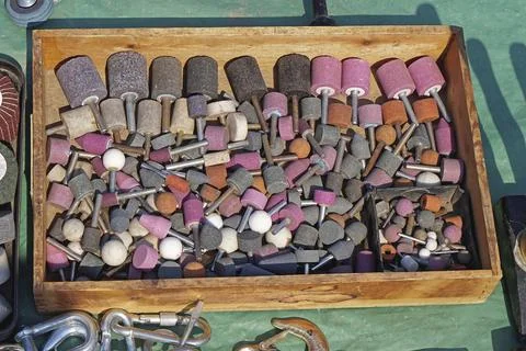 Grind stone bits tools in wooden box Stock Photos
