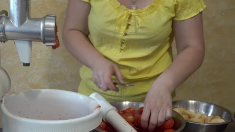 Grind tomatoes for tomato paste Stock Footage 294070439