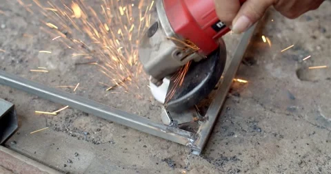Grind the workpiece to improve the surface after welding. Stock Footage 278674910