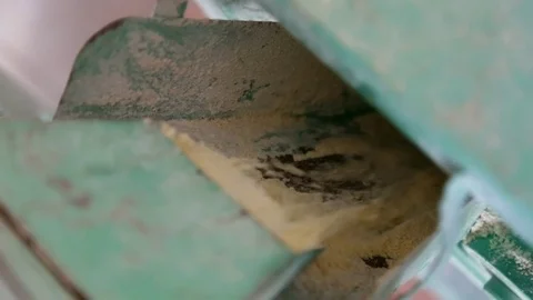 Grinded corn falls into the mill funnel Stock Footage 75467185