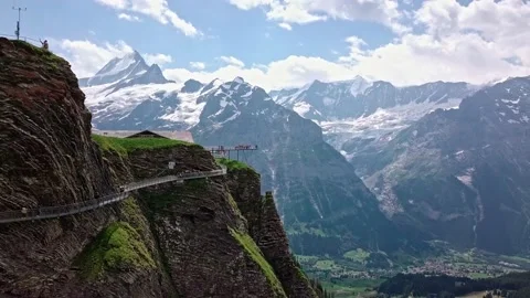 Grindelwald First Cliff Walk by Tissot in Switzerland - Aerial Drone Footage Stock Footage