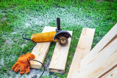 Grinder and abrasive tools left by the master after working on wooden boards Stock Photos