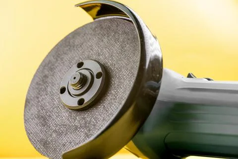 Grinder with cutting disc on background Stock Photos