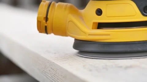 Grinder machine for wood, Eccentric orbital sander on wooden surface Stock Footage 162223991