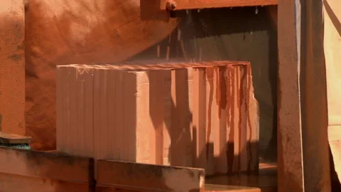 Grinder with mason blade cutting a brick for retaining wall Stock Footage 131960770