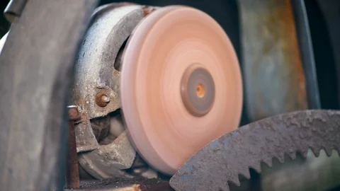 Grinder. Rotating disk of grinding machine. A machine for turning a round shape Stock Footage 112684578
