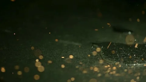 Grinder sparks falling on wet stone surface Stock Footage 327050983