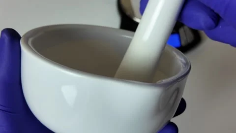Grinding and Mixing in Ceramic Mortar Stock-Footage 345259426