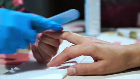 Grinding and preparation of nails for application of varnish Stock Footage 90410853